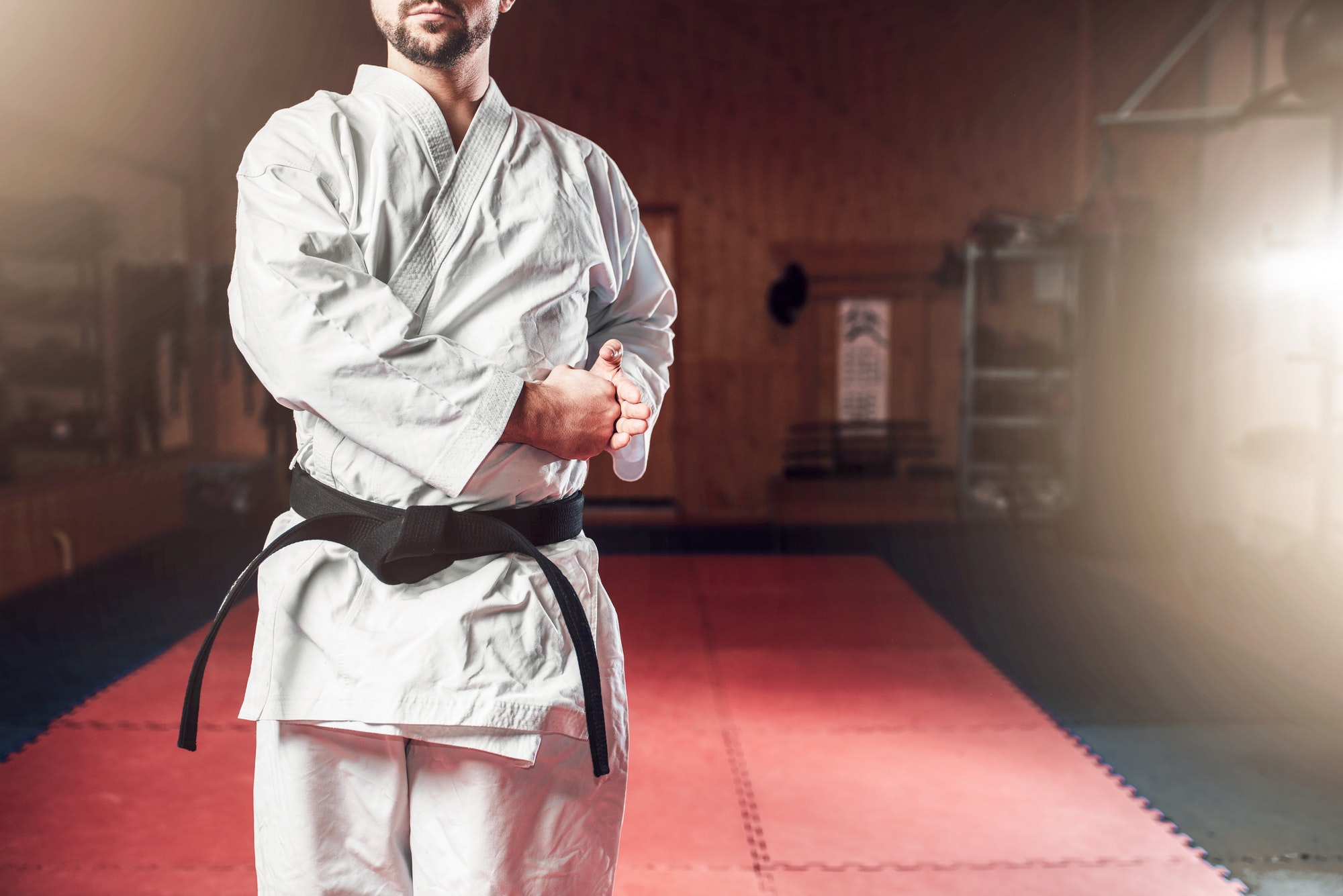 Martial arts, fighter in white kimono, black belt